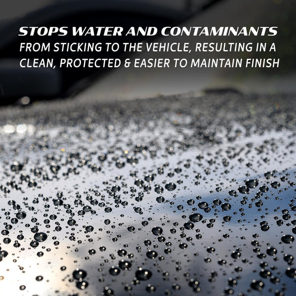 Water beading on a dark surface, reflecting the sky. Protection from Turtle Wax.