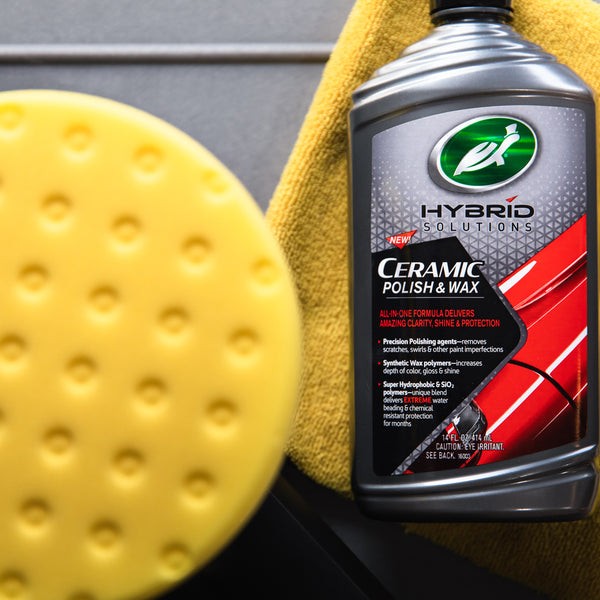 Turtle Wax Hybrid Solutions Ceramic Polish & Wax for auto paint clarity, shine, & protection. Includes an applicator pad and a microfiber towel.